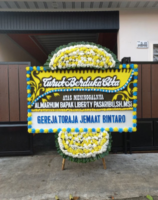 Papan Bunga Duka di Topos