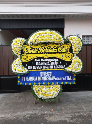 Papan Bunga Duka di Topos